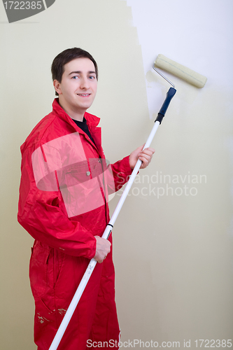 Image of Man painting a wall