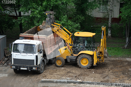 Image of Tractor. Cleaning the yard