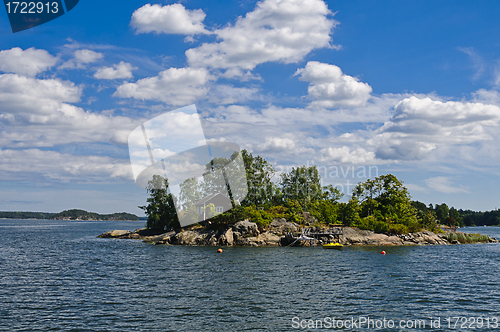 Image of Swedish red cottage on a small island