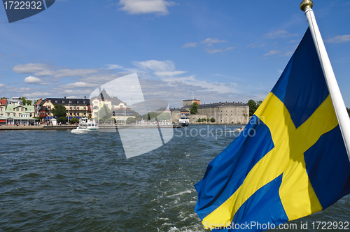 Image of Vaxholm fortress and Swedish flag, Stockholm archipelago, Sweden