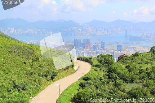 Image of Asphalt winding curve road to city