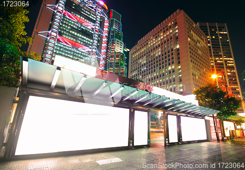 Image of Blank billboard on bus stop at night 