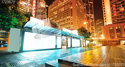 Image of Blank billboard on bus stop at night 