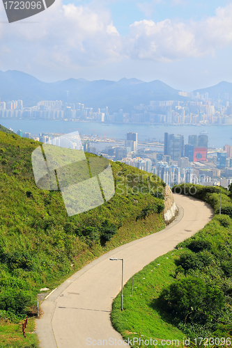 Image of Asphalt winding curve road to city