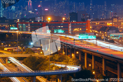 Image of highway traffic in city at night