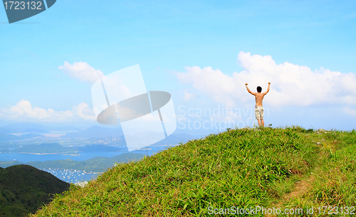 Image of Beautiful mountains landscape with lake in hongkong and man on t