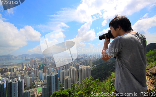 Image of photographer take photo of city