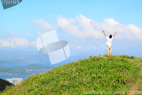 Image of Beautiful mountains landscape with lake in hongkong and man on t