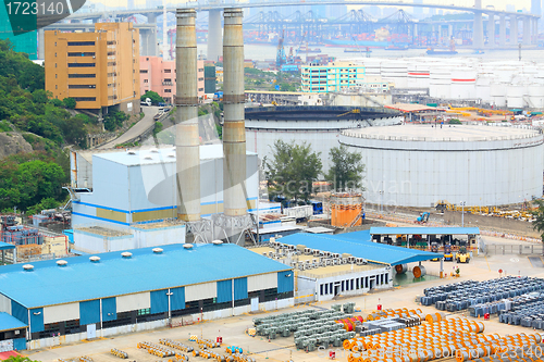 Image of power station , gas tank and cable roll