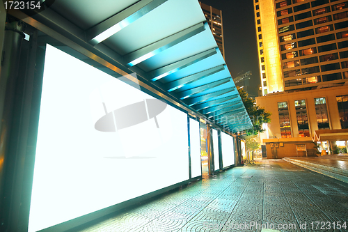 Image of Blank billboard on bus stop at night 