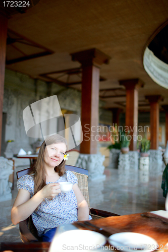 Image of Beautiful woman in restaurant