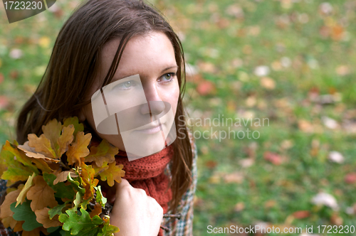 Image of Beautiful young woman in the park