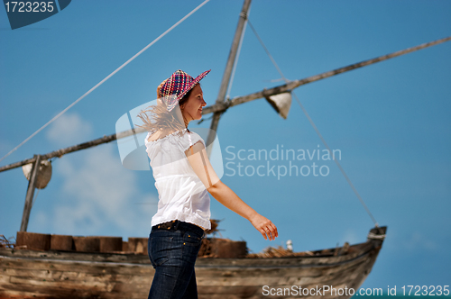 Image of Young girl and boat