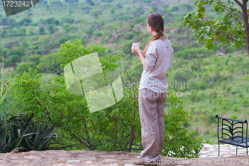 Image of Woman enjoying savanna views