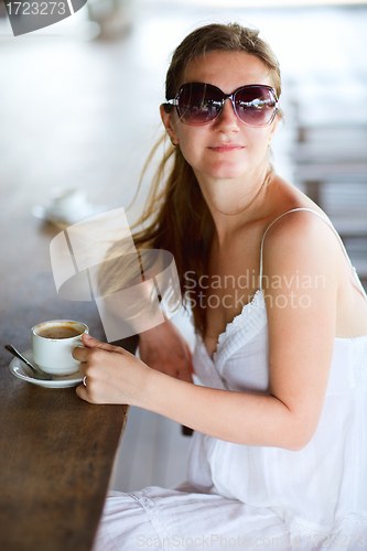 Image of Woman drinking coffee