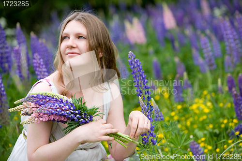 Image of Beautiful woman in a meadow
