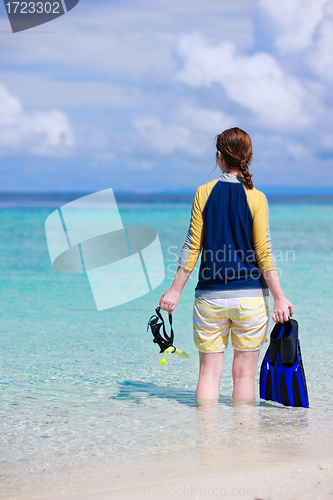 Image of Woman holding snorkeling equipment  