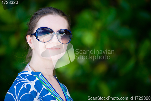 Image of Portrait of beautiful woman in sun glasses