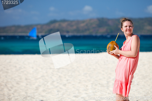 Image of Young woman with coconut