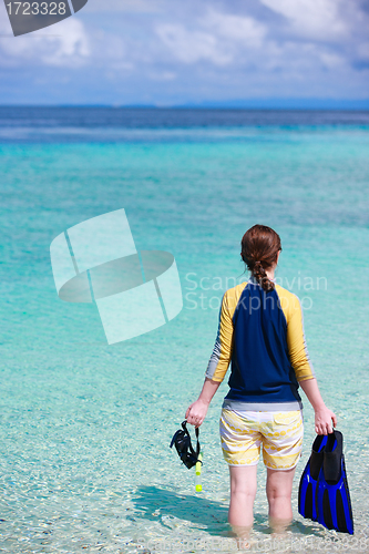 Image of Woman holding snorkeling equipment  