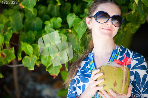 Image of Portrait of beautiful with coconut