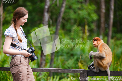 Image of Female photographer and proboscis monkey