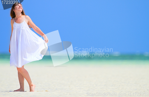 Image of Woman enjoying beach vacation