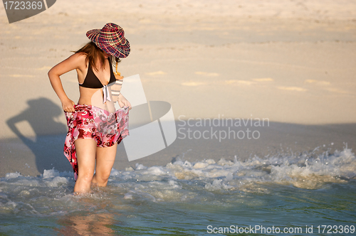 Image of Young girl splashing water