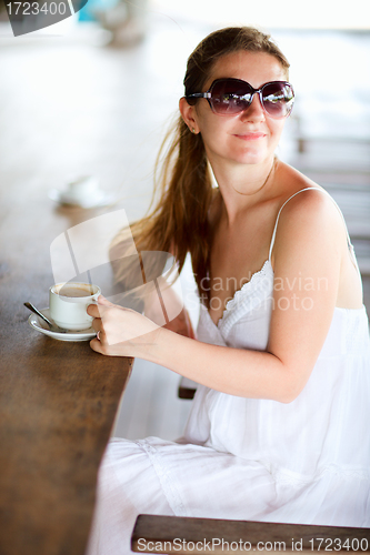 Image of Woman in cafe