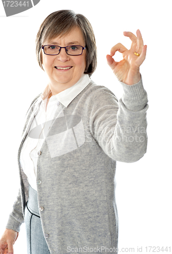 Image of Old lady showing excellent gesture