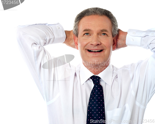 Image of Relaxed aged businessman dreaming