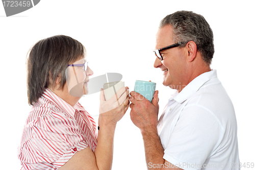 Image of Romantic senior old couple enjoying coffee