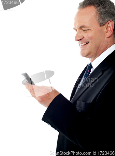 Image of Business executive reading text sms