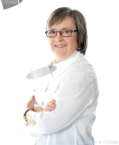 Image of Side view of smiling senior female manager