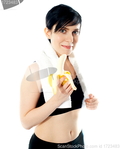 Image of Pretty woman with banana