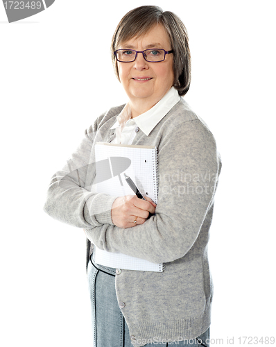 Image of Senior woman with folder and pen