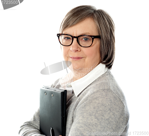 Image of Attractive old orporate lady holding business document