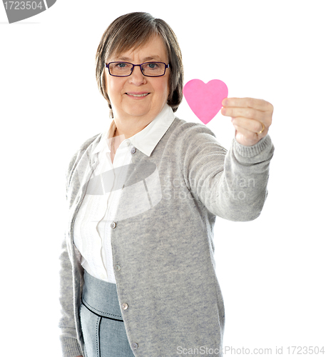 Image of Female holding a pink paper heart
