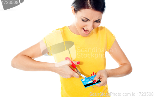 Image of Unhappy female customer destroying her atm card