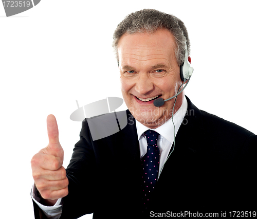 Image of Call centre executive smiling with thumbs-up