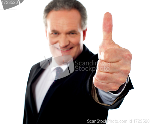 Image of Successful entrepreneur gesturing thumbs-up