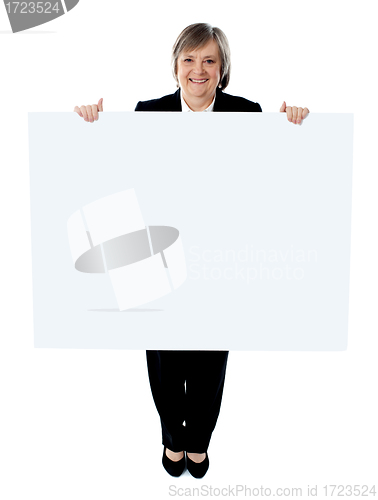 Image of Businesswoman holding a blank poster