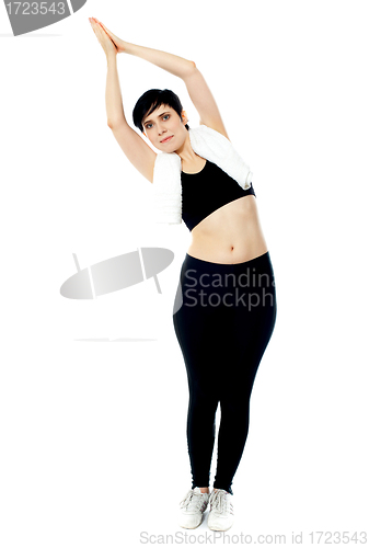 Image of Fit female instructor doing stretching exercise