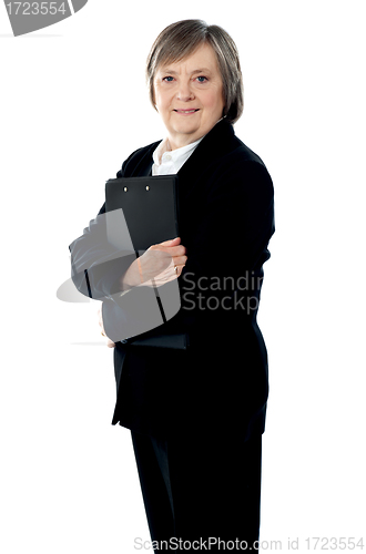 Image of Corporate lady posing with documents