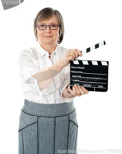 Image of Attractive senior woman using clapperboard