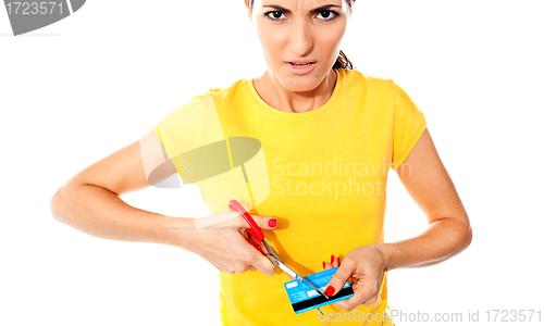 Image of Annoyed teen customer destroying credit card