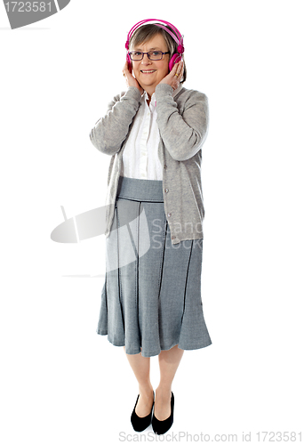 Image of Aged lady listening music