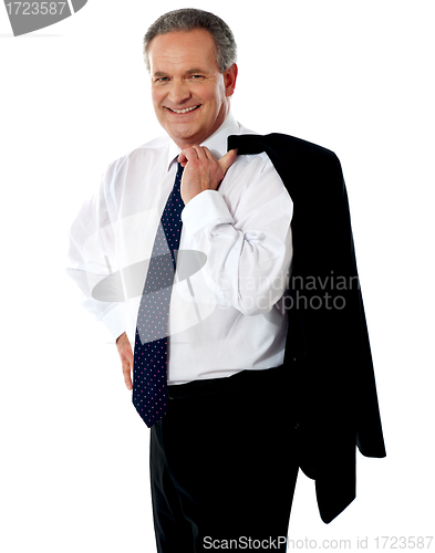 Image of Senior male executive holding coat over his shoulders