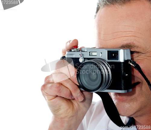 Image of Cropped image of aged male photographer