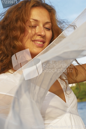 Image of Young woman with white scarf